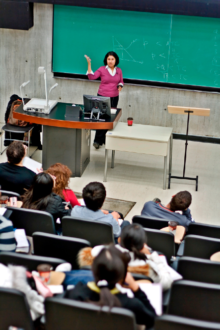 A professor teaching a classrooom of students