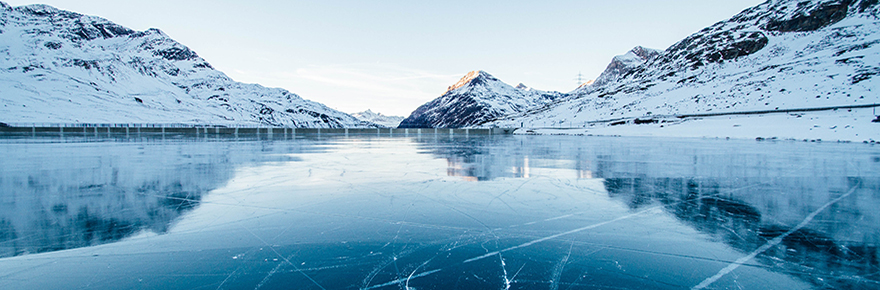 Image shows a lake with ice on it