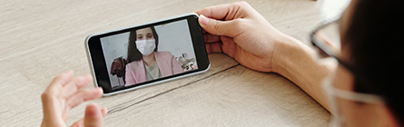 Image shows two people talking over video chat