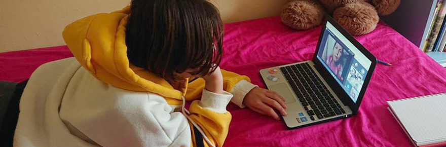Student Phoebe Lawson-Morrow watches the online play from home. Photo credit: Martin Morrow