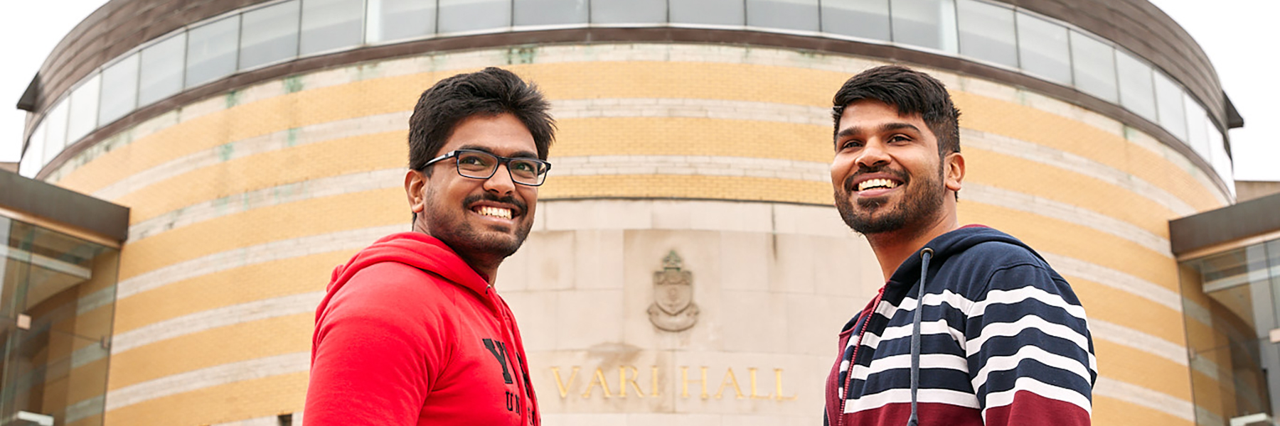 Two students in front of Vari Hall