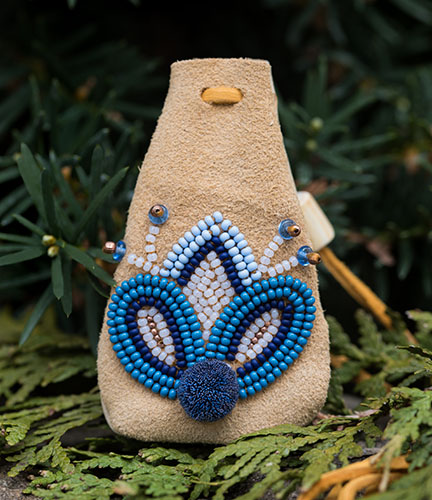 Marissa Magneson “Medicine Pouch” (@MagnesonStudios) Design by Dylan Miner (@wiisaakodewinini), Beadwork and tufting on leather