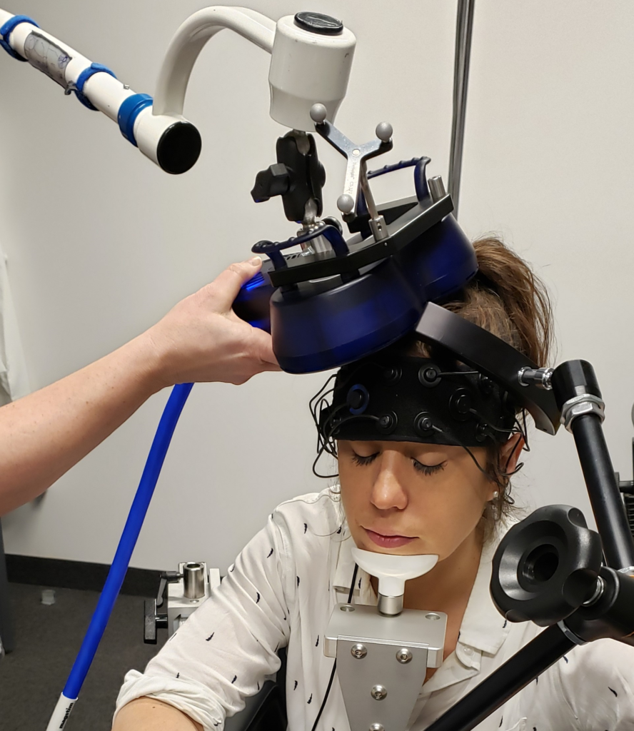 Ozzy Mermut experiences neurostimulation of her brain with transcranial magnetic stimulation. As part of this procedure, there is also an evaluation of her hemodynamic response using functional near infrared spectroscopy 