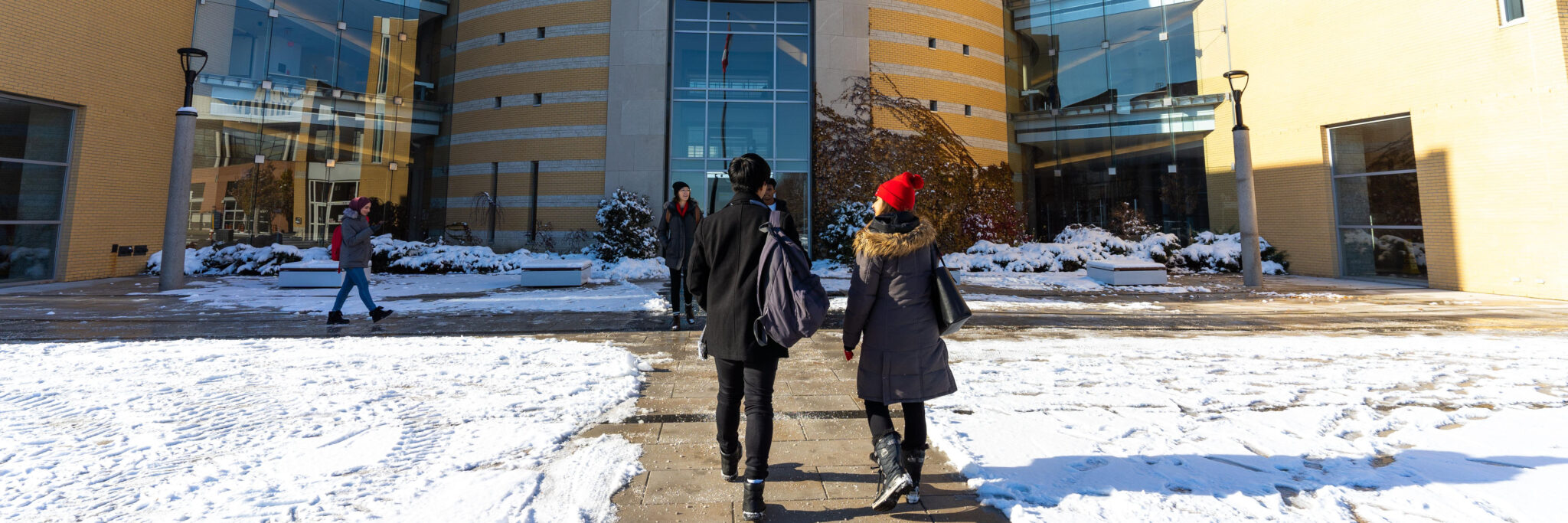 Students entering Vari Hall during winter