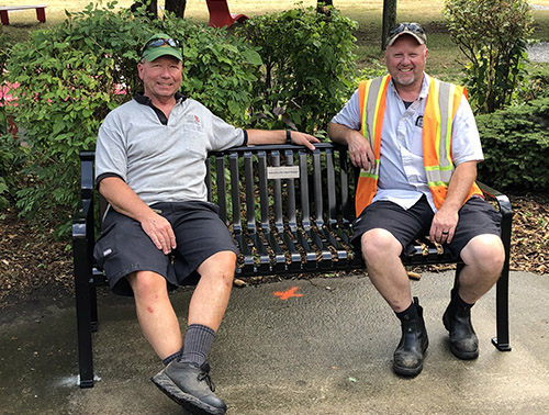 Jeff Hutchings and Brad Vaine installed the bench. Both are operators for Grounds, Fleet and Waste Management in Facilities Services