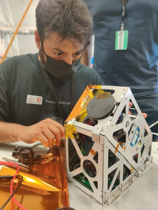 PhD candidate Siddharth Dave helps to prepare the Star Tracker for launch.