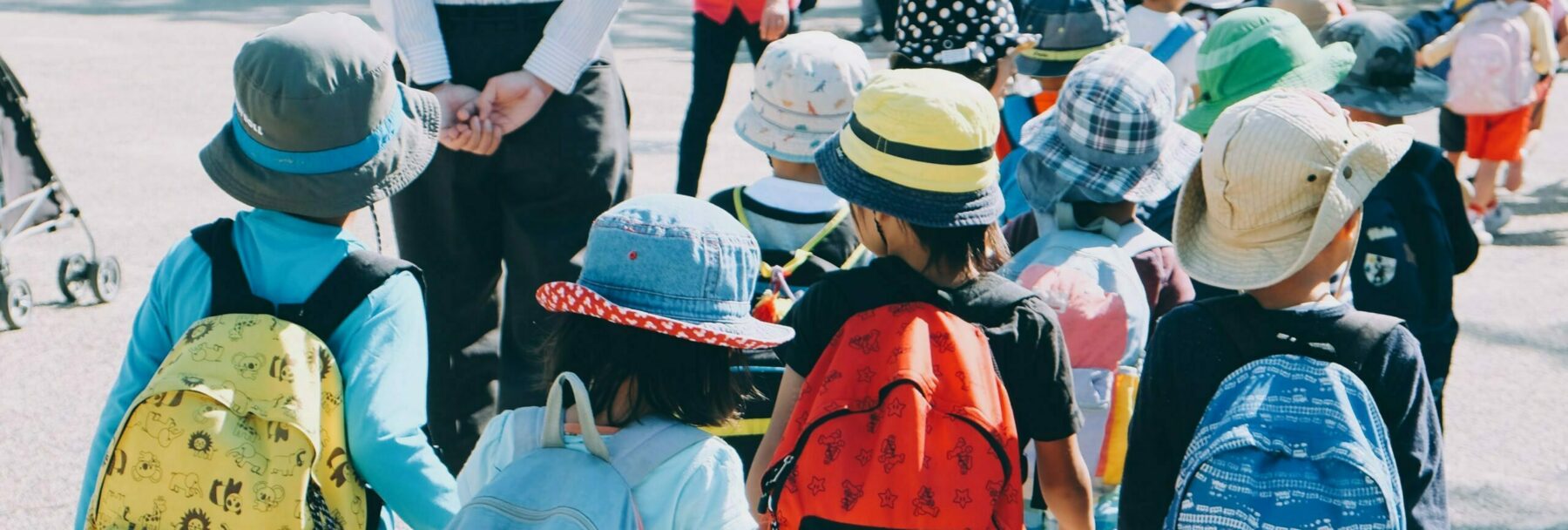A group of children with backpacks on a school trip