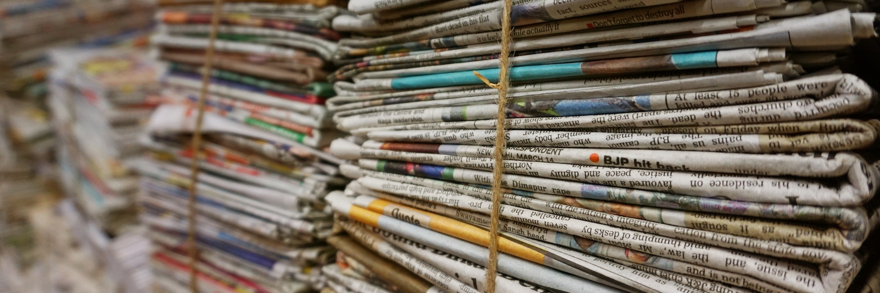 A pile of newspapers tied with a string