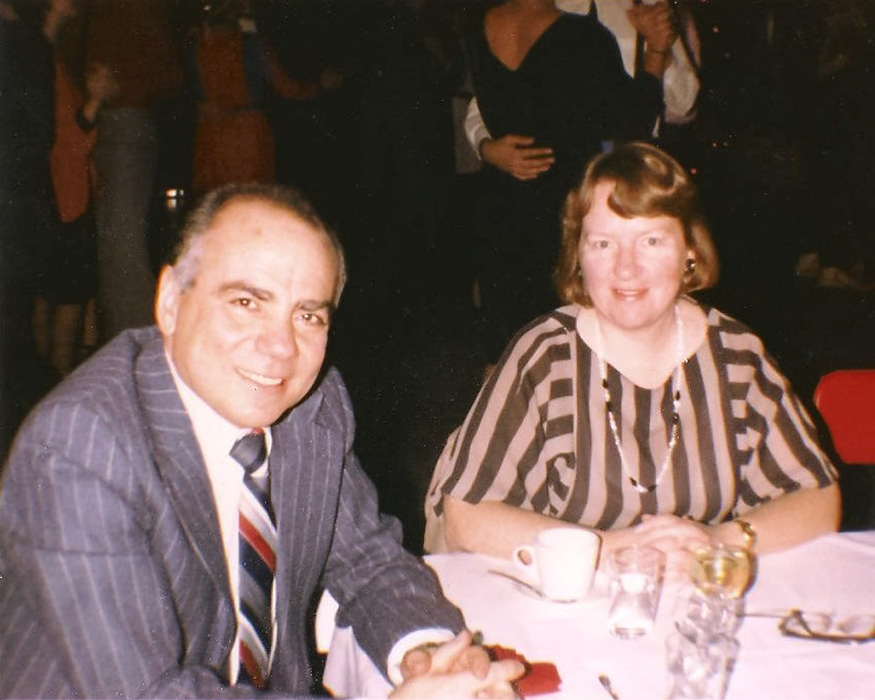 Professors Elizabeth "Betty" Sabiston and Hedi Bouraoui seated at a formal dinner in 1982.