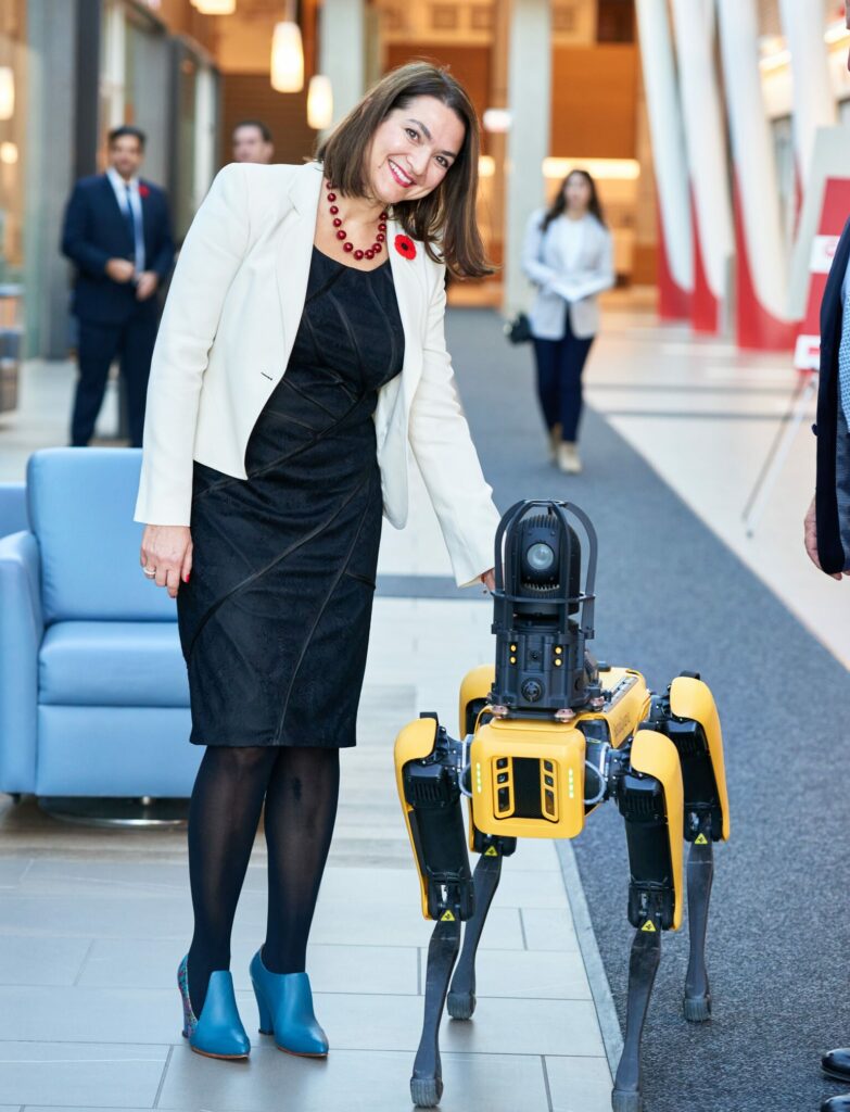 Pina D'Agostino with an AI robot