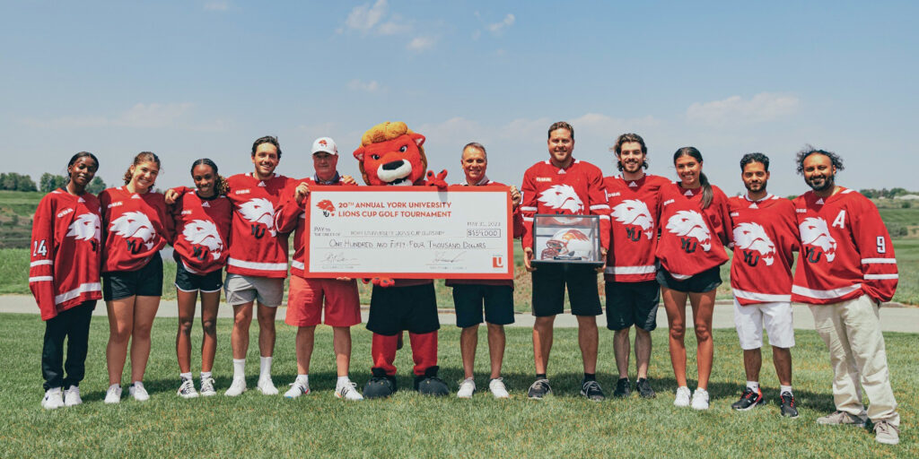 Participants in 20th annual Lions Cup golf tournament receive $154,000 cheque with mascot Yeo
