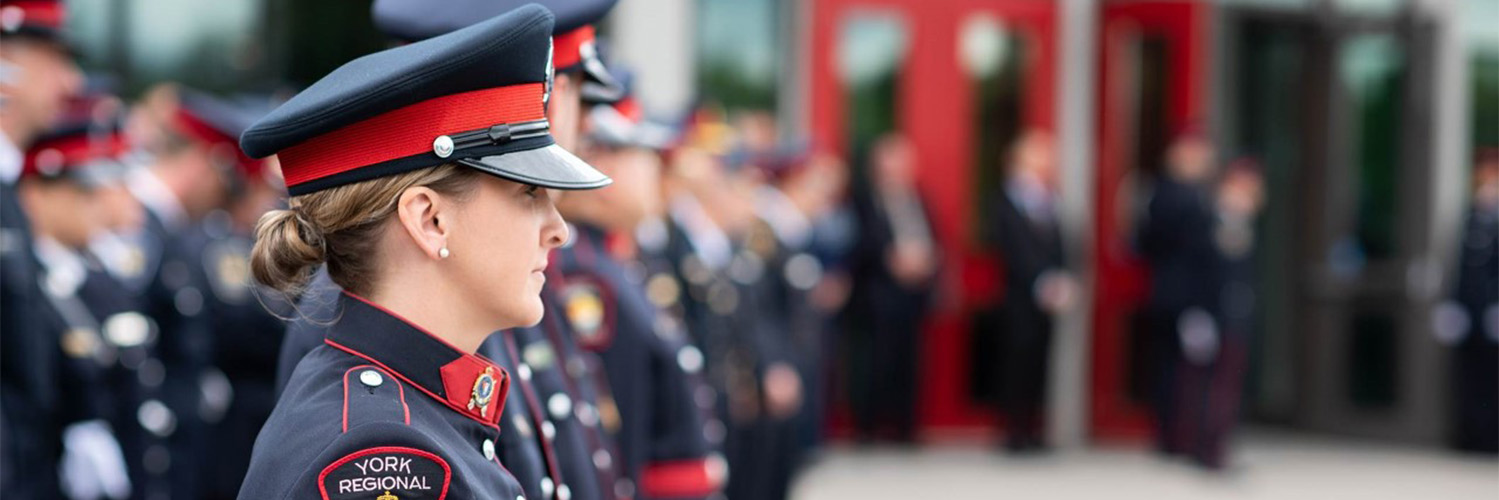 York Regional Police officers standing in a row in ceremonial uniforms