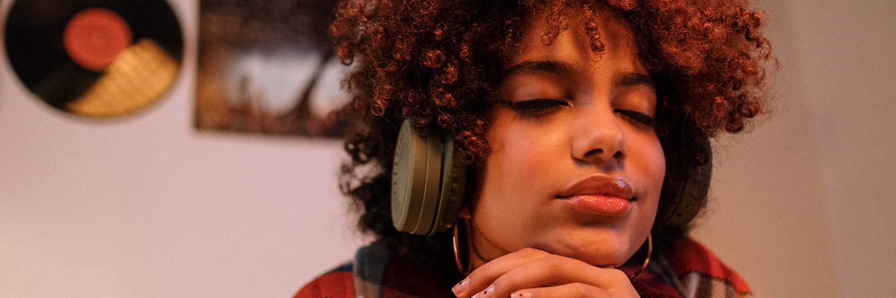 Woman enjoying listening to something with headphones on