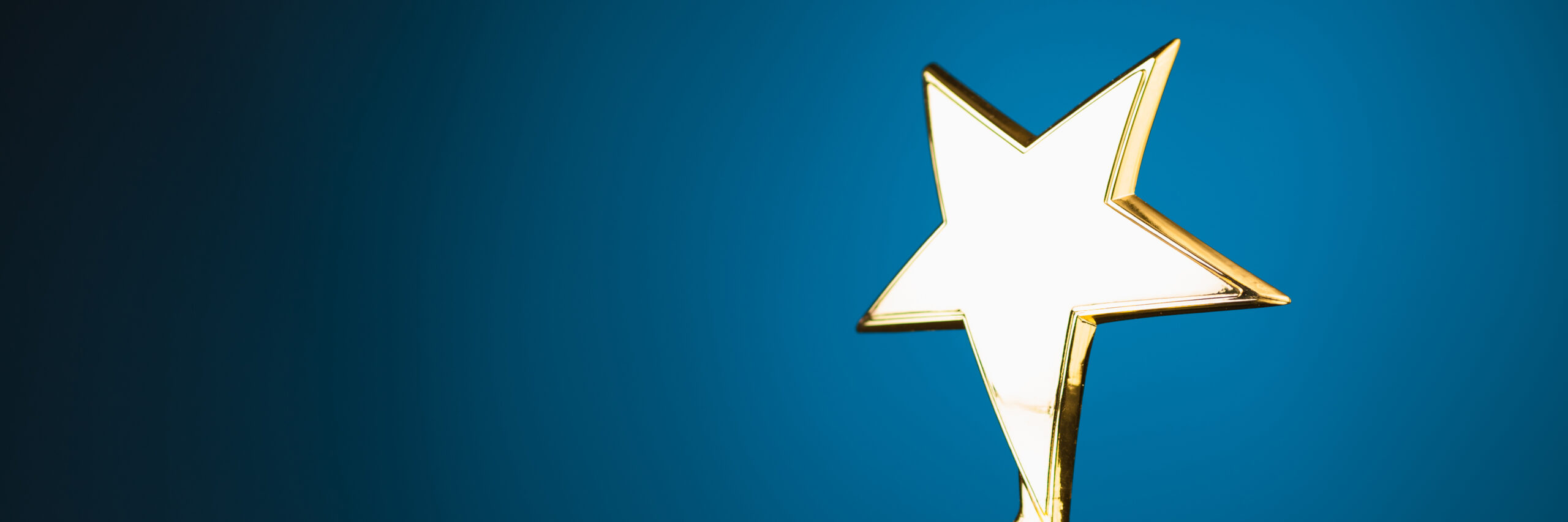 gold star award on a blue background