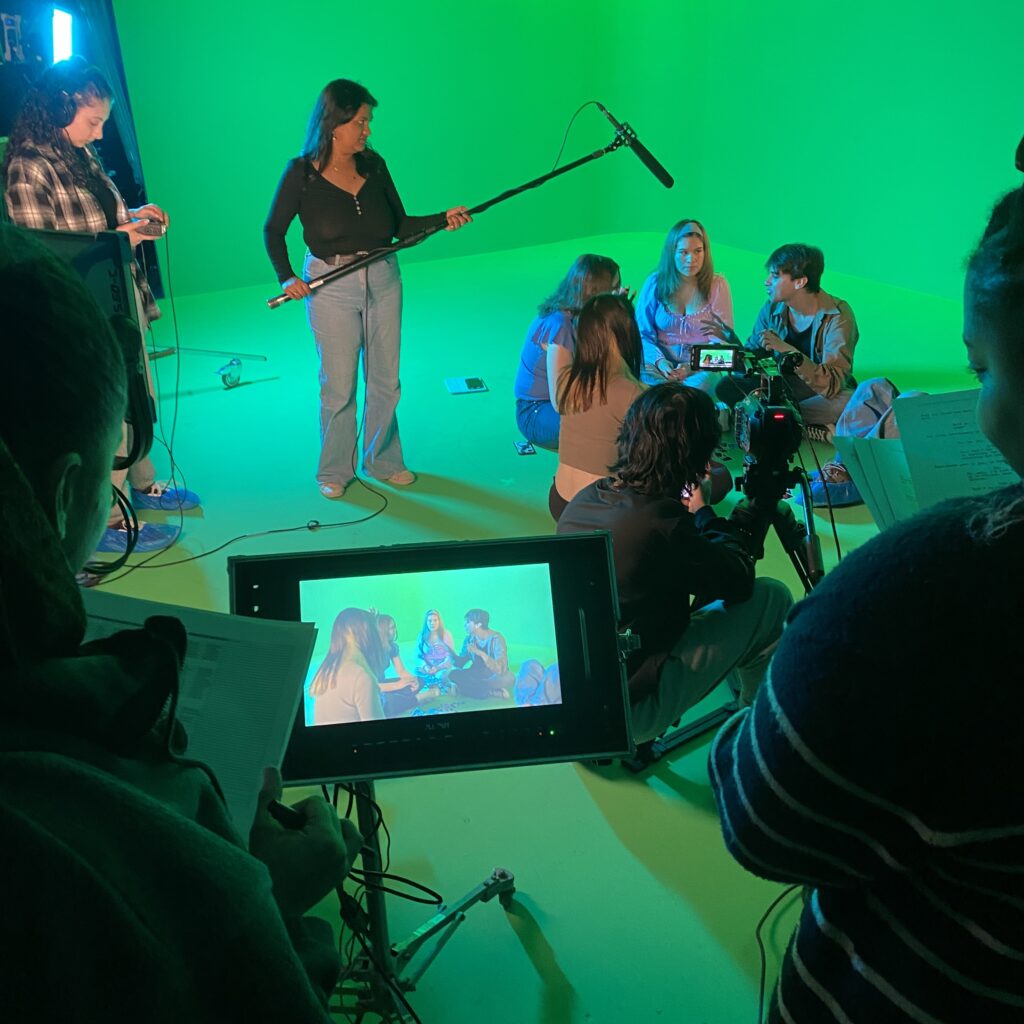 AMPD students in Shooting the Set course working with the green screen
