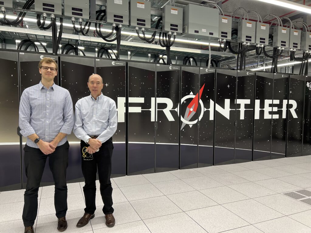 ork University Assistant Professor Miles Couchman (left) and collaborator Professor Steve de Bruyn Kops (right) in front of the Frontier Supercomputer at the Oak Ridge National Laboratory, the largest supercomputer in the world