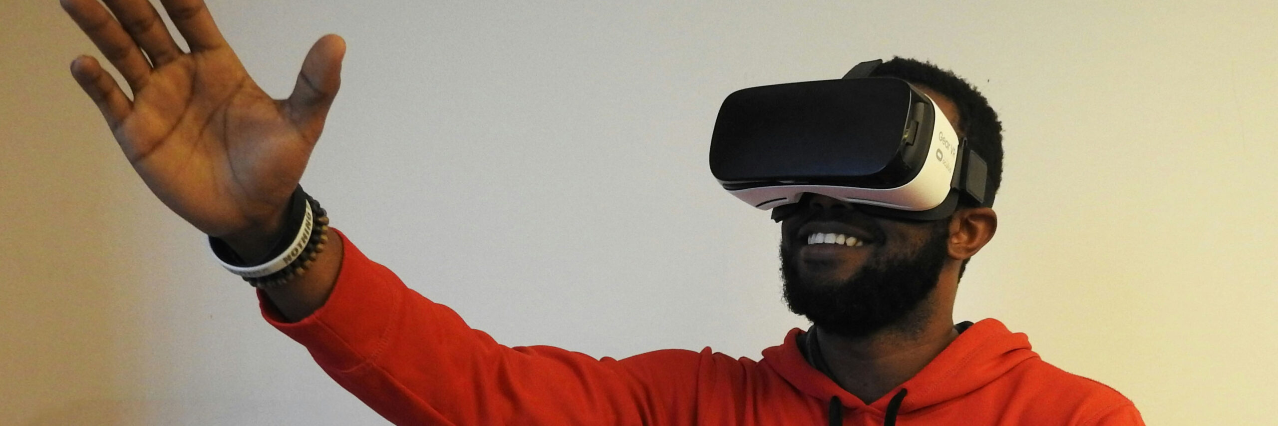 Black man wearing virtual reality headset BANNER