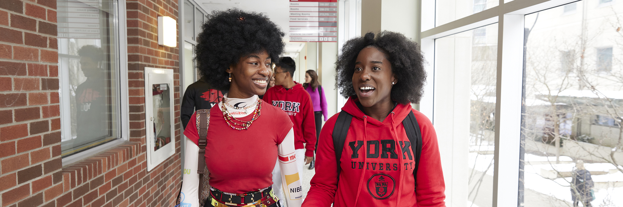 Two Black students walking inside on York's Keele Campus