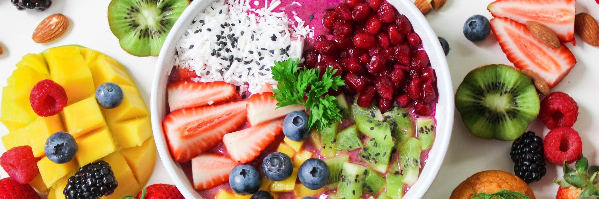 bowl of colorful food surrounded