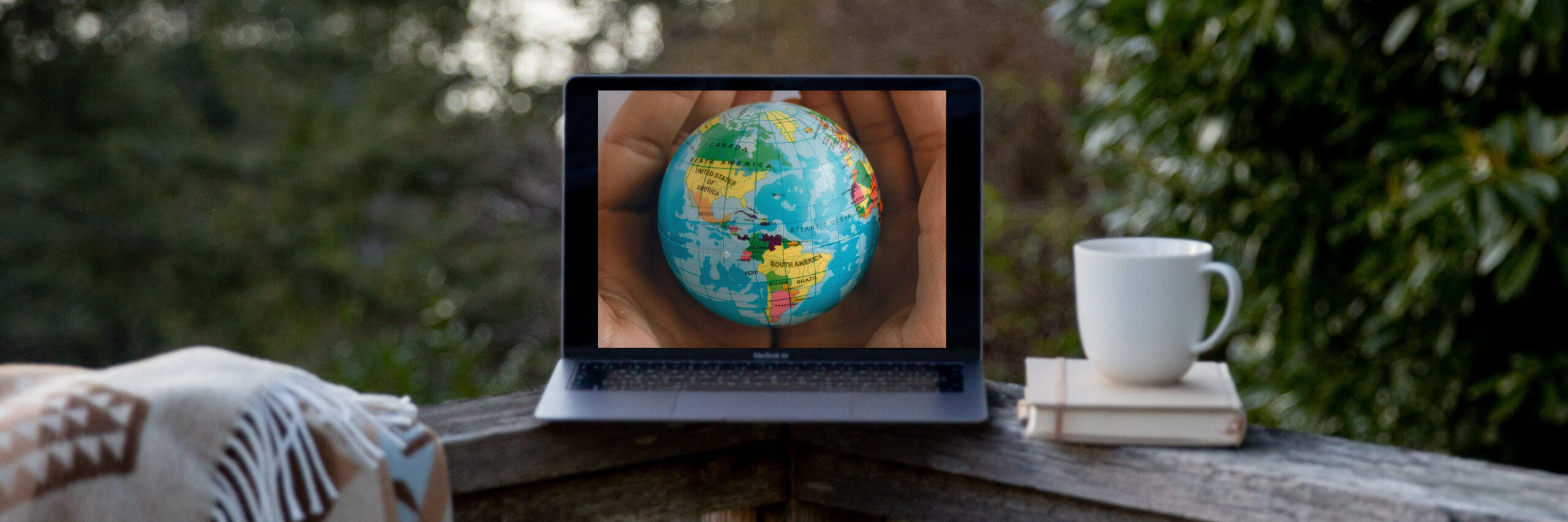 laptop with globe on screen