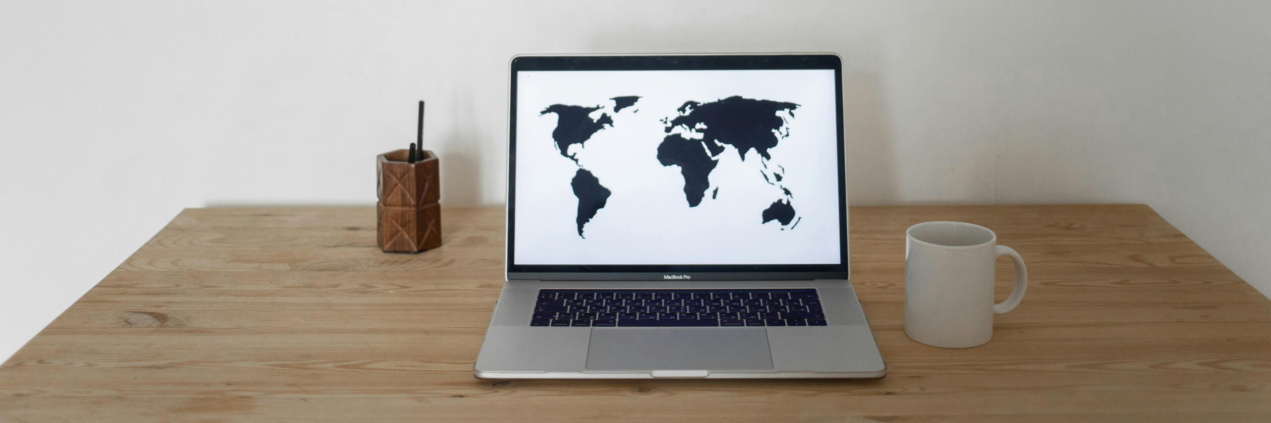 image of the world on laptop BANNER