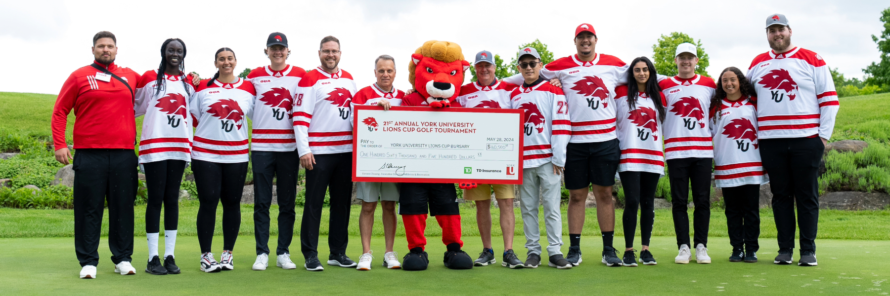 Members of York Athletics & Recreation pose with Lions Cup Tournament cheque